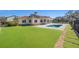 Backyard with synthetic grass, patio and pool at 12329 Sw 140Th Loop, Dunnellon, FL 34432