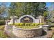 Bel Lago community sign with mature landscaping at 12329 Sw 140Th Loop, Dunnellon, FL 34432