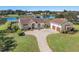 Stunning single-story home with tile roof, circular driveway and attached garage at 12329 Sw 140Th Loop, Dunnellon, FL 34432