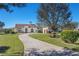 Lovely single-Gathering home with a well-manicured front yard and long, winding driveway at 12329 Sw 140Th Loop, Dunnellon, FL 34432