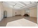 Spacious garage with epoxy flooring, ample lighting, and room for storage and vehicles at 12329 Sw 140Th Loop, Dunnellon, FL 34432