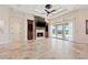 Bright living room featuring tile floors, a fireplace, and sliding glass doors to the patio at 12329 Sw 140Th Loop, Dunnellon, FL 34432