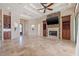 Bright and airy living room featuring tile floors, fireplace, and built-in shelving at 12329 Sw 140Th Loop, Dunnellon, FL 34432