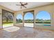 Spacious patio with travertine floors and an open view to backyard and pool at 12329 Sw 140Th Loop, Dunnellon, FL 34432