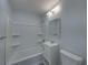 Clean bathroom with white vanity, a tub-shower combination and neutral walls at 2625 Williston Dr, Lakeland, FL 33801