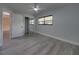 Light and airy bedroom with a mirrored closet door and a view of the window at 2625 Williston Dr, Lakeland, FL 33801