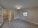 Spacious bedroom features new flooring with access to bathroom and closet at 2625 Williston Dr, Lakeland, FL 33801