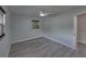 Neutral bedroom with a ceiling fan, one window, and light gray flooring at 2625 Williston Dr, Lakeland, FL 33801
