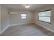 Bright bedroom featuring new flooring and neutral walls at 2625 Williston Dr, Lakeland, FL 33801