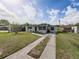 The home's exterior features a well-manicured lawn and a lengthy driveway at 2625 Williston Dr, Lakeland, FL 33801