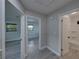 Hallway view with a bedroom to the left and a bathroom to the right at 2625 Williston Dr, Lakeland, FL 33801