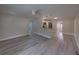Open-concept living room with modern flooring that flows into the updated kitchen at 2625 Williston Dr, Lakeland, FL 33801