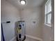 Functional utility room with a modern water heater, offering essential home services and a neat appearance at 2625 Williston Dr, Lakeland, FL 33801