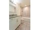 Bathroom featuring a granite vanity and tiled tub and shower with soap shelf at 30505 Island Club Dr., Deer Island, FL 32778
