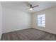Well-lit bedroom featuring a ceiling fan, carpeted floor, and bright trim at 30505 Island Club Dr., Deer Island, FL 32778