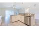 Bright open kitchen featuring granite countertops, stainless steel appliances, and tiled floors at 30505 Island Club Dr., Deer Island, FL 32778