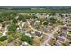 Property aerial showcasing the home's location within a lush, green neighborhood at 4889 Myrtle View N Dr, Mulberry, FL 33860
