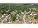 Wide aerial view of a residential area with homes nestled among mature trees at 4889 Myrtle View N Dr, Mulberry, FL 33860
