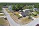 An aerial view of a home featuring a fenced backyard, green lawn, and inviting neighborhood at 4889 Myrtle View N Dr, Mulberry, FL 33860