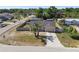 Bird's-eye view of house with fenced yard, driveway and mature trees at 4889 Myrtle View N Dr, Mulberry, FL 33860