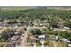 Panoramic aerial showcases a quiet, tree-lined residential community at 4889 Myrtle View N Dr, Mulberry, FL 33860