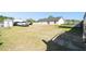 Expansive backyard featuring a shed, truck, and trampoline, perfect for recreation and storage solutions at 4889 Myrtle View N Dr, Mulberry, FL 33860