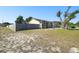 Side view of home showing fenced-in yard and potential for outdoor activities at 4889 Myrtle View N Dr, Mulberry, FL 33860