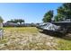 Spacious backyard showing an expanse of land with trailers, perfect for storage and outdoor activities at 4889 Myrtle View N Dr, Mulberry, FL 33860
