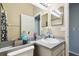 Bright bathroom featuring an expansive mirror, vanity with ample counter space and a toilet at 4889 Myrtle View N Dr, Mulberry, FL 33860
