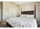 Spacious bedroom features a bed with decorative floral bedding and a spacious closet at 4889 Myrtle View N Dr, Mulberry, FL 33860
