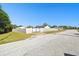 Exterior view of the property, with a fenced yard and back gate providing privacy and security at 4889 Myrtle View N Dr, Mulberry, FL 33860