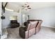 Spacious living room with a vaulted ceiling, tile floors, and a cozy seating area at 4889 Myrtle View N Dr, Mulberry, FL 33860