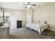 Comfortable main bedroom with neutral carpet, ceiling fan, and an ensuite bathroom at 4889 Myrtle View N Dr, Mulberry, FL 33860