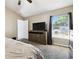Comfortable main bedroom features neutral carpet, a ceiling fan, and ample natural light at 4889 Myrtle View N Dr, Mulberry, FL 33860