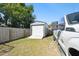 Backyard shed with a door next to a truck, providing space for storage and home projects at 4889 Myrtle View N Dr, Mulberry, FL 33860