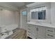 Newly remodeled bathroom featuring a white vanity with ample storage, tiled shower and updated fixtures at 66 Alachua Dr, Winter Haven, FL 33884