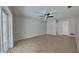 Bedroom with sliding door, ceiling fan, tile flooring, and neutral paint at 66 Alachua Dr, Winter Haven, FL 33884