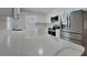 Stylish kitchen features white cabinets, stainless steel appliances, and stone countertops at 66 Alachua Dr, Winter Haven, FL 33884