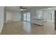 Inviting living area with tile floors, neutral walls, ceiling fan and access to the pool area at 66 Alachua Dr, Winter Haven, FL 33884