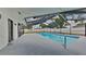 The screened in pool and patio area is perfect for entertaining guests or enjoying a relaxing swim at 66 Alachua Dr, Winter Haven, FL 33884