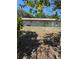 Back of the home with a simple yard and a small patio area, offering a blank canvas for personalization at 8955 Rhoden Loop W Rd, Fort Meade, FL 33841