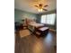 Bedroom showcasing a wooden bedframe, matching side tables, and a cozy rug at 8955 Rhoden Loop W Rd, Fort Meade, FL 33841