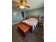 Bedroom featuring a wooden bedframe, matching side tables, and a chest for storage at 8955 Rhoden Loop W Rd, Fort Meade, FL 33841