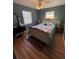 Bedroom with a bed, vanity, and natural light coming through the windows at 8955 Rhoden Loop W Rd, Fort Meade, FL 33841