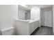 Bathroom featuring a large mirror and double sink vanity at 591 Bay Leaf Dr, Poinciana, FL 34759