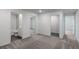 Hallway with access to rooms, featuring carpeted floors and neutral walls at 591 Bay Leaf Dr, Poinciana, FL 34759