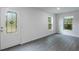 Open concept Living Room with a decorative glass front door and natural light at 591 Bay Leaf Dr, Poinciana, FL 34759