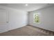 Neutral bedroom features neutral carpet, a double door closet and natural light at 607 Bay Leaf Dr, Poinciana, FL 34759