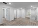Upstairs hallway features multiple bedrooms, lots of lighting, and neutral carpeting at 607 Bay Leaf Dr, Poinciana, FL 34759