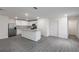 Spacious kitchen features stainless steel appliances, center island, and wood flooring at 607 Bay Leaf Dr, Poinciana, FL 34759